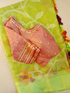 Lime Green Muslin Jamdaani saree with a peach pink crush tissue work blouse