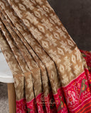Twill Patola saree in a lovely shade of light brown and red