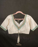 Off white blouse with blue patchwork embroidery