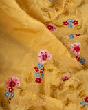 Lovely yellow tissue saree with beautiful thread embroidered border