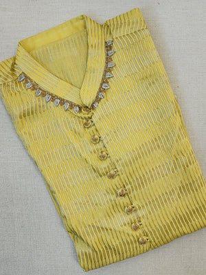 Lovely yellow silk kurta with Zari lines and hand embroidery across the neckline.