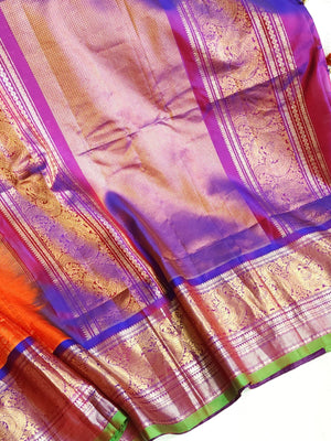 A grand Gadwal Kanchi saree in orange for your joyous occasions
