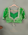 Parrot Green Crush Tissue saree with a stunning net sleeves blouse