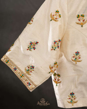 Off white blouse with beautifully designed Patola-inspired embroidery