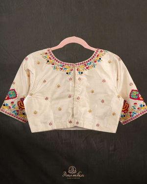 Off white blouse with beautifully designed Patola-inspired embroidery