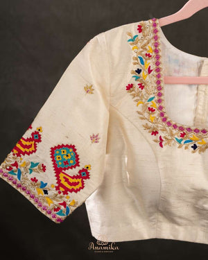 Off white blouse with beautifully designed Patola-inspired embroidery