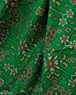 Pure Patola silk saree in a lovely shade of green and pink