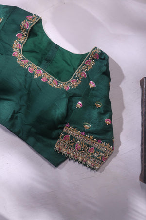 Raw Mango saree in bubble gum pink paired with a contrast dark green blouse