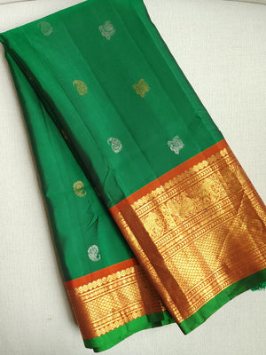 Traditional Green and rust orange Kanchipattu saree