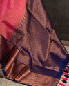 Kanchipattu saree in lovely rose pink shade with a contrast dark blue border