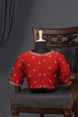 A beautiful red blouse with stunning neckline