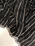 Falling organza saree in black with all over sequins work