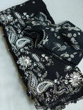 A pure crepe saree in black with stunning silver embroidered border