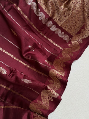 Raw  mango Pattu saree in maroon paired with a contrast mauve lilac blouse
