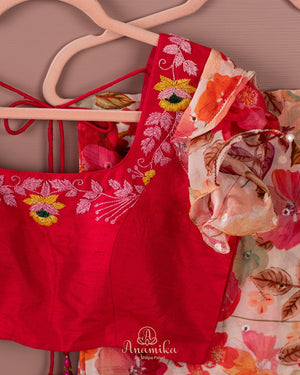 Beige Floral Chinnon saree with a contrast tomato pink handwork blouse