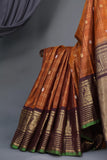 Rich kanjeevaram saree in rust orange and brown border