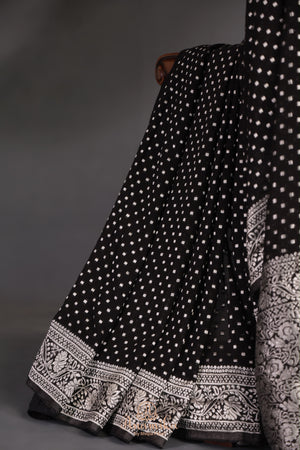 A graceful black Georgette saree with stylish full sleeves blouse