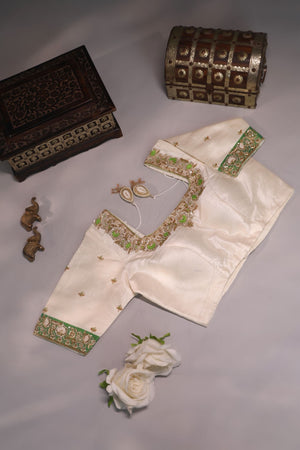 Green Tissue Kanchi saree with a contrast off white blouse