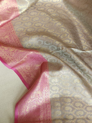 Kanjeevaram in a beautiful shade of gray with a contrast pink border.