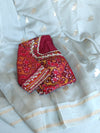 Flowy Malai silk saree in grey paired with a red Patola blouse