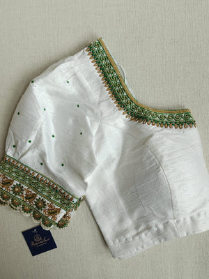 Banarasi Dupion saree in dark green with gold Zari border and motifs