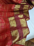 A stunning vintage kanjeevaram in rust orange with a deep maroon border