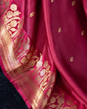 Raw mango pattu saree in a lovely shade of pink paired with a contrast floral blouse