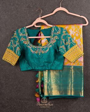 A meenakari kanjeevaram saree in yellow and teal