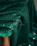 Dark bottle Green georgette sequins saree paired with a stunning blouse and belt