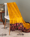 Yellow pure silk saree with contrast brown floral cutwork border