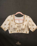 Off white blouse with beautifully designed Patola-inspired embroidery