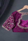 A classic patola in purple with a striking border