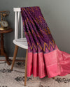 A purple kanchi soft silk saree with peach pink border