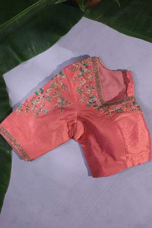 Green Kanjeevaram saree with a peach pink border