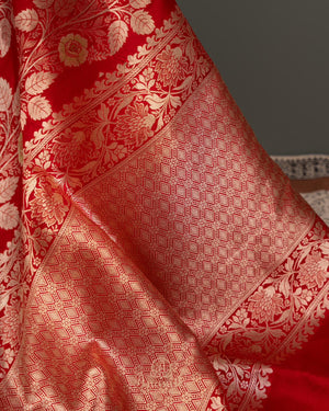 Red Banarasi saree with a heavy bridal zardosi work blouse