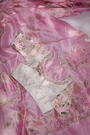 A beautiful rose pink tissue saree with an off white blouse