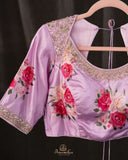 A beautiful Floral blouse in pastel pink with intricately designed embroidery