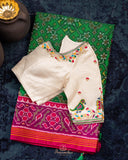 Pure Patola silk saree in a lovely shade of green and pink