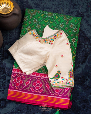 Pure Patola silk saree in a lovely shade of green and pink