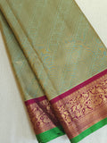 A Royal Gadwal kanchi saree in sage green with rich magenta border