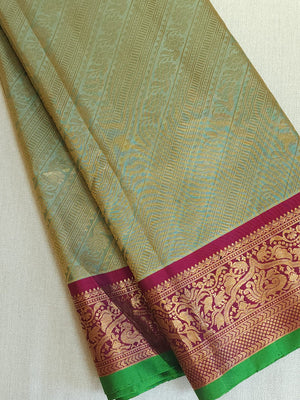 A Royal Gadwal kanchi saree in sage green with rich magenta border