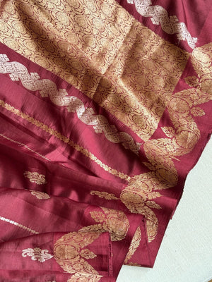 Raw  mango Pattu saree in maroon paired with a contrast mauve lilac blouse