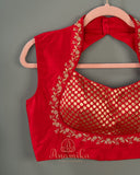 Red sleeveless blouse with halter neck pattern