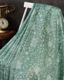 Organza saree in sage green with all over thread embroidery