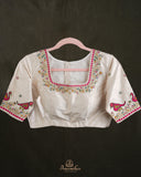 Off white blouse with beautifully designed Patola-inspired embroidery