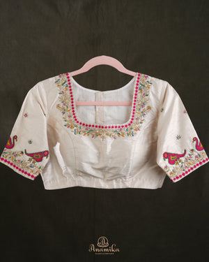 Off white blouse with beautifully designed Patola-inspired embroidery