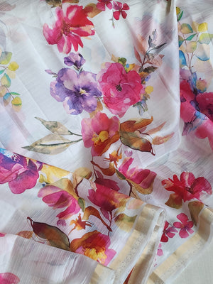 White floral pure silk saree with a contrast pink blouse