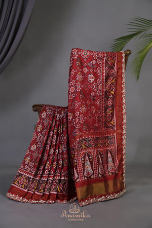 Patan Patola saree with intricately designed maggam work border