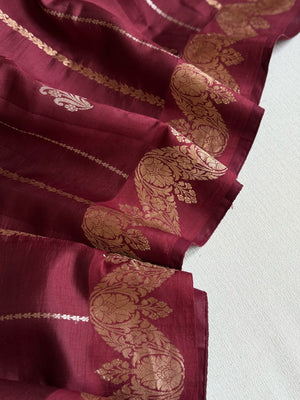 Raw  mango Pattu saree in maroon paired with a contrast mauve lilac blouse