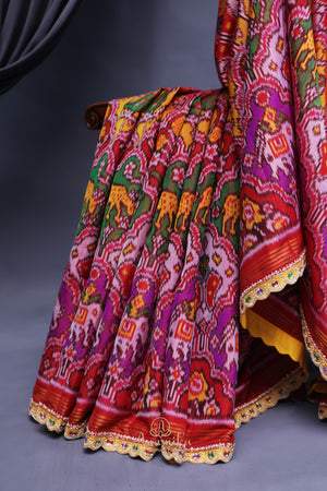 Patan Patola saree with intricately designed maggam work border